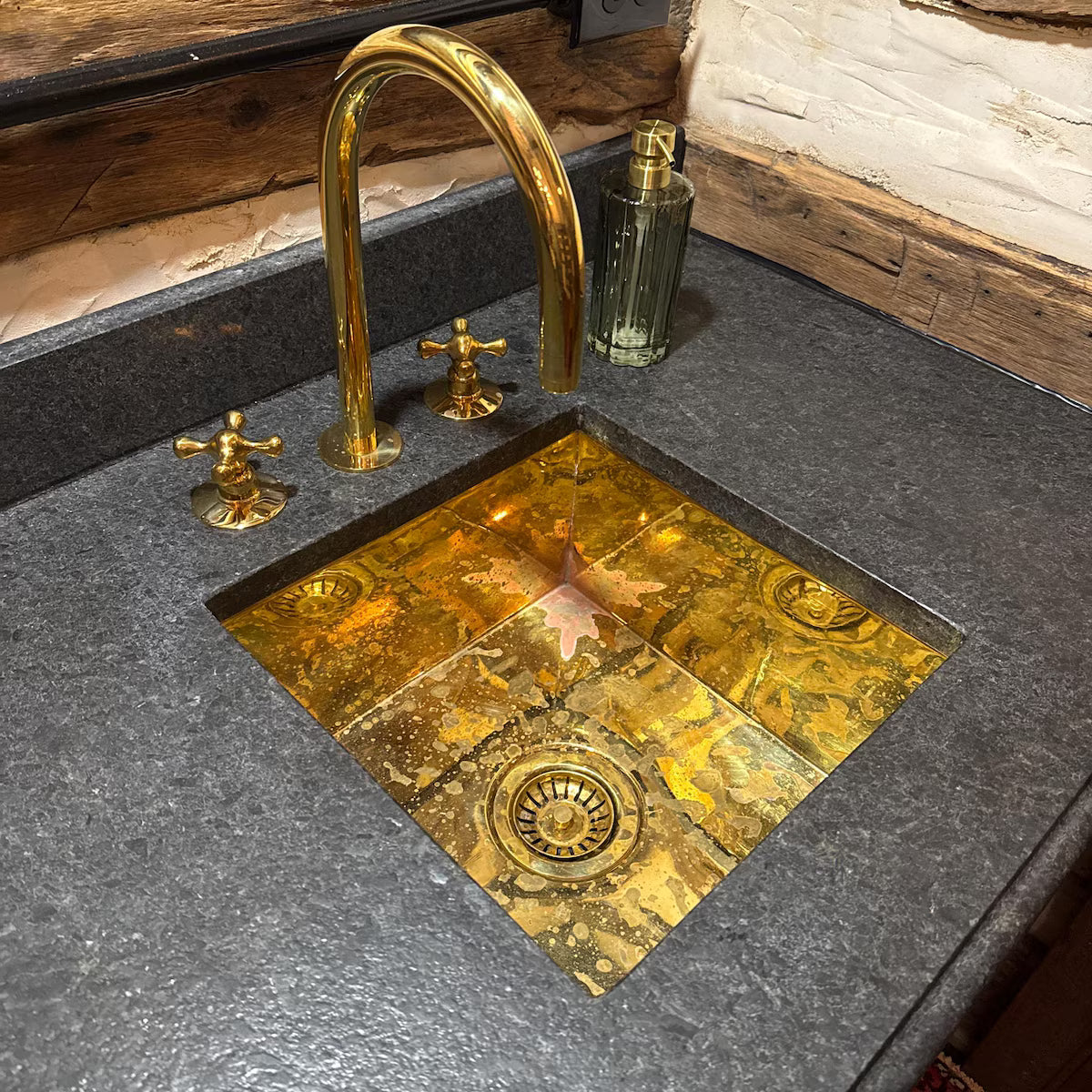Handcrafted polished undermount sink in solid brass — kitchen island installation, Marrakesh Morocco