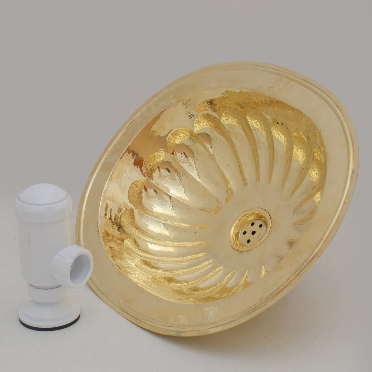 Handcrafted petal-etched oval solid brass drop-in sink, reviewed by Lexis