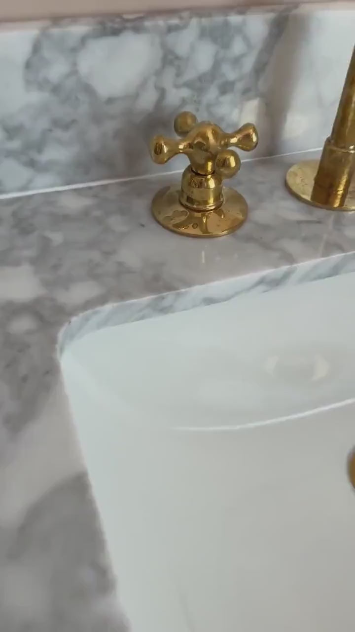 Load video: Deck Mounted Unlacquered Brass Faucet, Vanity Sink Faucet, Antique Brass Bathroom Faucet