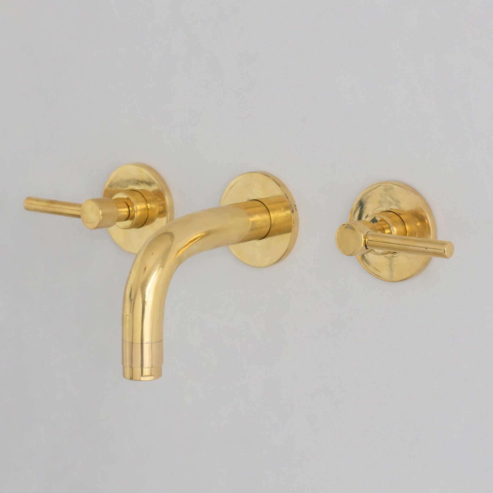 Unlacquered brass mini wall mount faucet, full view