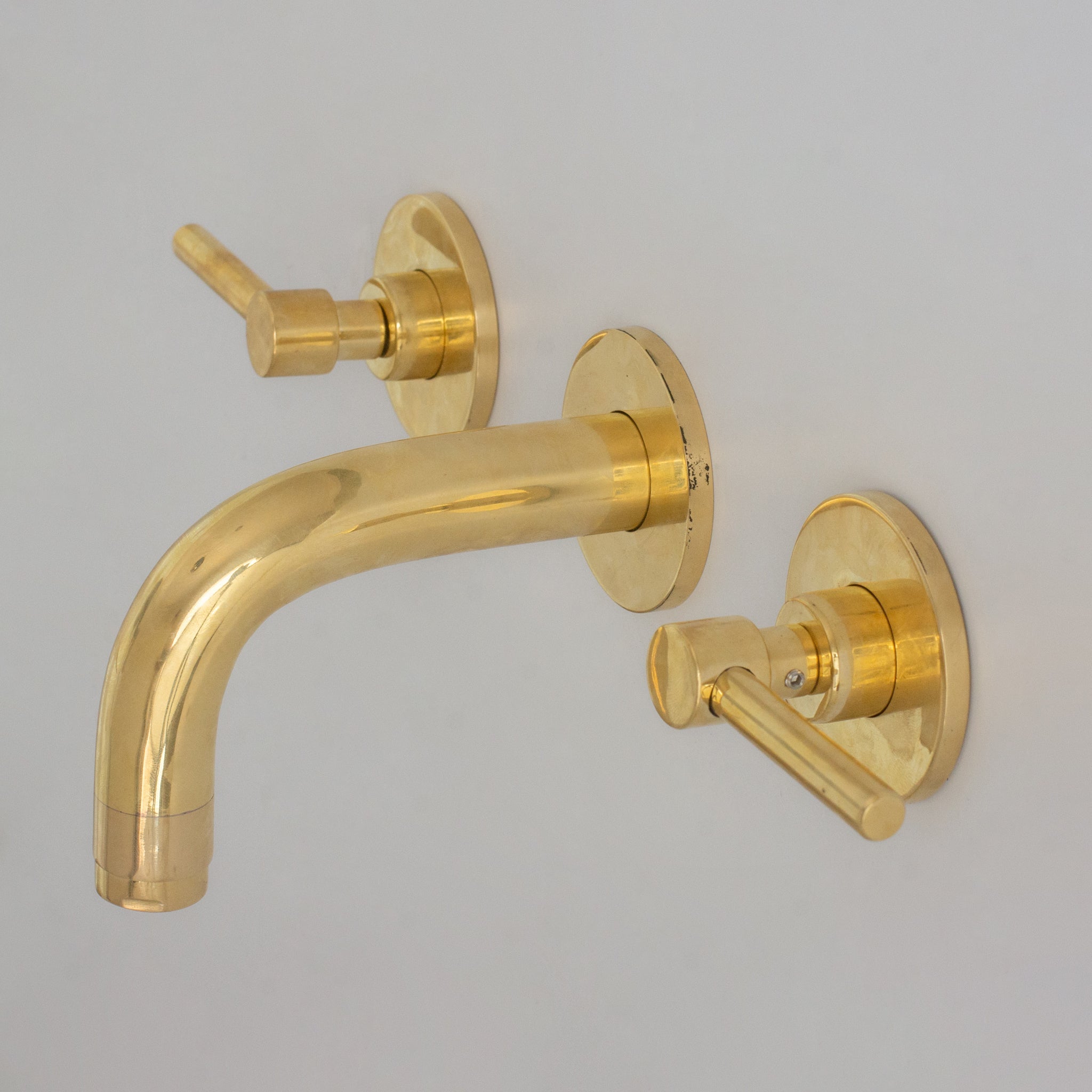 Unlacquered brass mini wall mount sink faucet with lever handles