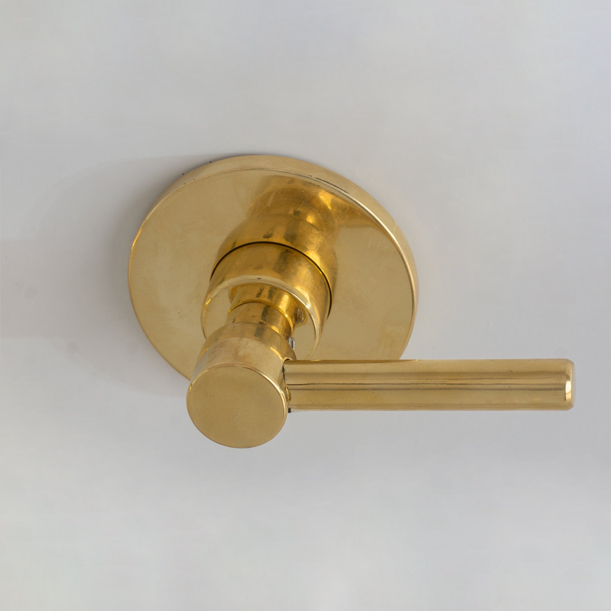 Lever handle close-up in unlacquered brass