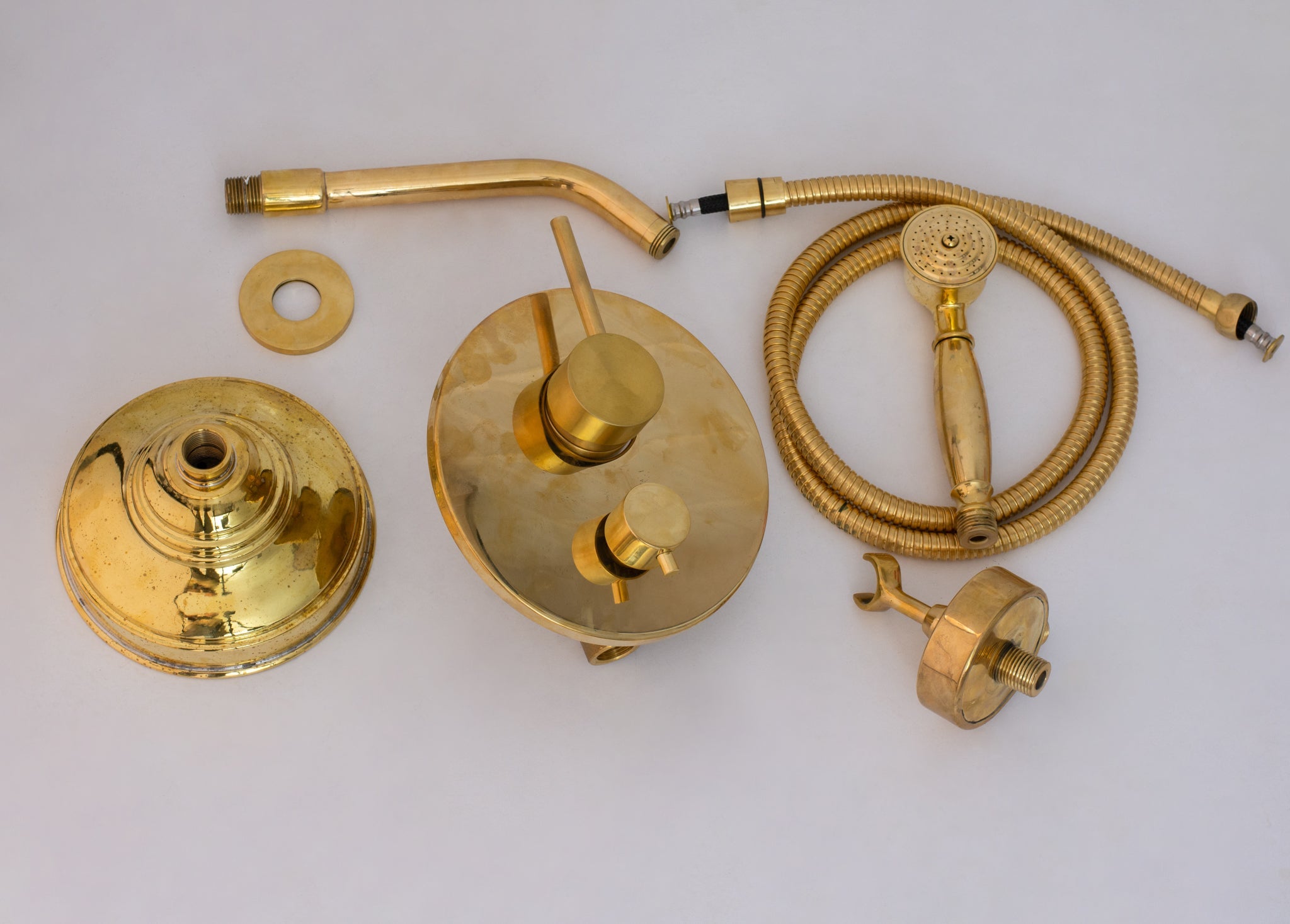 Wall cutaway showing the concealed brass shower installation